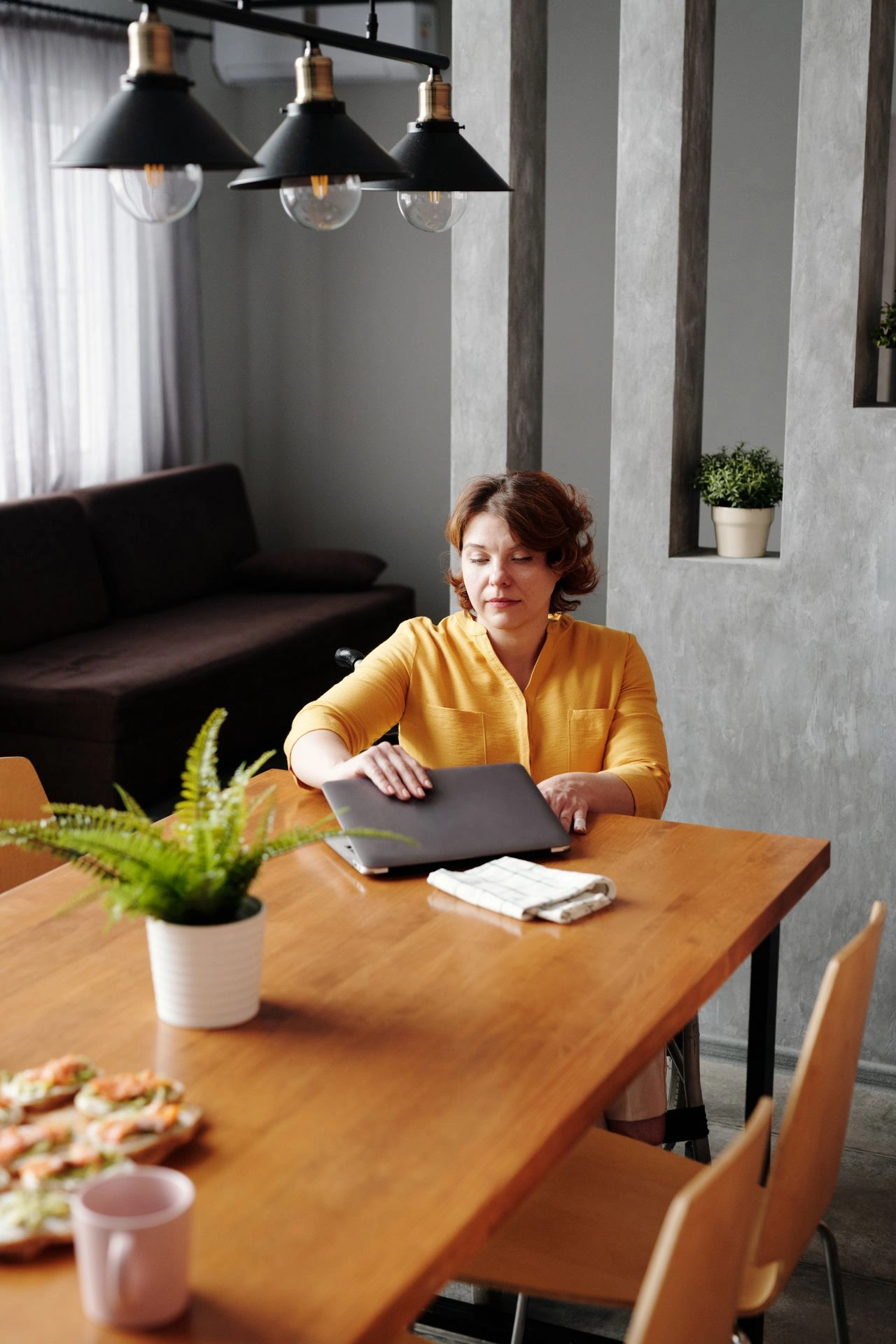 Creator putting away digital work equipment to maintain personal boundaries